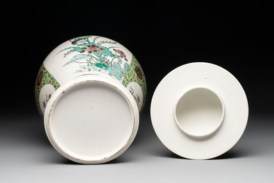 A pair of Chinese verte-biscuit 'cranes and flowers' vases and covers, 19th C.