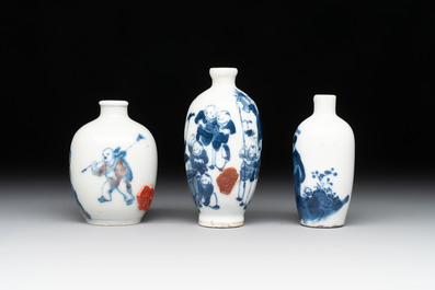 Three Chinese blue, white and copper-red snuff bottles with figural design, Yongzheng and Qianlong mark, 19th C.