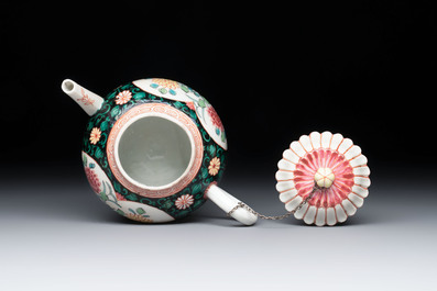 A Chinese famille rose black-ground teapot and stand with floral design, Yongzheng/Qianlong