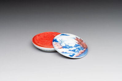A fine Chinese blue, white and copper-red 'riverscape' seal paste box and cover, Kangxi mark, 19/20th C.