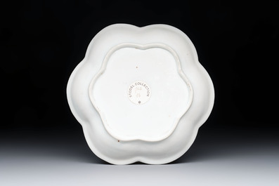 A Chinese famille rose black-ground teapot and stand with floral design, Yongzheng/Qianlong