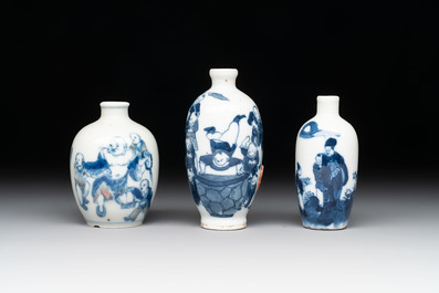 Three Chinese blue, white and copper-red snuff bottles with figural design, Yongzheng and Qianlong mark, 19th C.