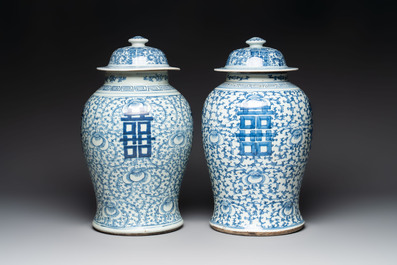 Two Chinese blue and white 'double happiness' covered vases and two 'meiping' vases, Kangxi mark, 19th C.
