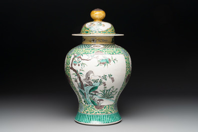 A pair of Chinese verte-biscuit 'cranes and flowers' vases and covers, 19th C.