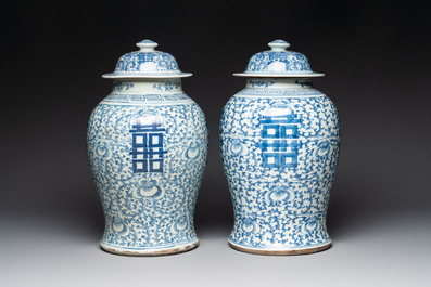Two Chinese blue and white 'double happiness' covered vases and two 'meiping' vases, Kangxi mark, 19th C.