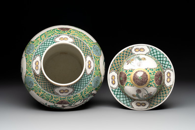A pair of Chinese verte-biscuit 'cranes and flowers' vases and covers, 19th C.