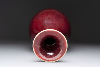A large Chinese flamb&eacute;-glazed 'yuhuchunping' vase on a wooden stand, 19th C.