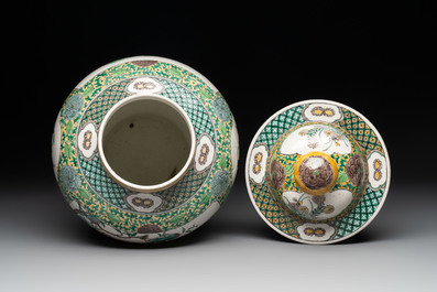 A pair of Chinese verte-biscuit 'cranes and flowers' vases and covers, 19th C.