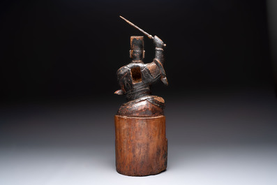 A Chinese gilt-lacquered wooden sculpture of a guardian, 19th C.