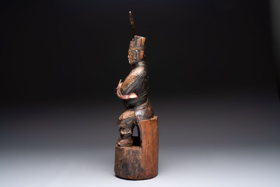 A Chinese gilt-lacquered wooden sculpture of a guardian, 19th C.