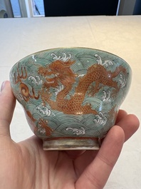 A pair of Chinese gilt and iron-red decorated 'dragons on waves' bowls, Jiaqing mark, 19th C.