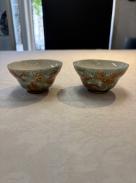 A pair of Chinese gilt and iron-red decorated 'dragons on waves' bowls, Jiaqing mark, 19th C.