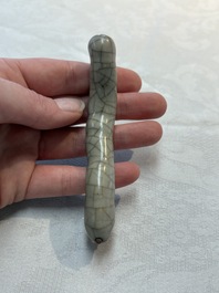 A rare Chinese ge-type model of a silkworm on wooden stand, 18th C.