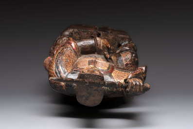 A Chinese gilt-lacquered wooden sculpture of a guardian, 19th C.