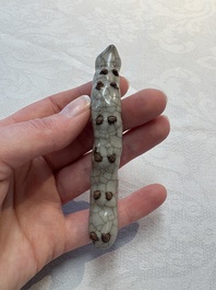 A rare Chinese ge-type model of a silkworm on wooden stand, 18th C.