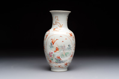 A Chinese famille rose vase and a small qianjiang cai vase, Qianlong mark, 19th C.