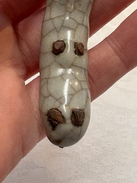 A rare Chinese ge-type model of a silkworm on wooden stand, 18th C.