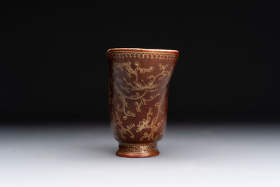 A Chinese gilt-decorated brown-glazed libation cup with a chilong-form handle, Qianlong mark and of the period