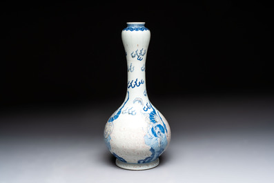 A Chinese blue, white and copper-red garlic-mouth vase with mythical animals, Kangxi mark, 19th C.