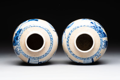 A Chinese famille verte covered vase, a pair of blue and white jars on wooden stands and two jars, 19th C.