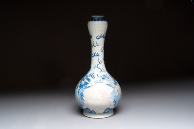 A Chinese blue, white and copper-red garlic-mouth vase with mythical animals, Kangxi mark, 19th C.