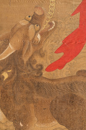 Chinese school: 'Deity and foo dog', ink and colour on silk, 16/17th C.