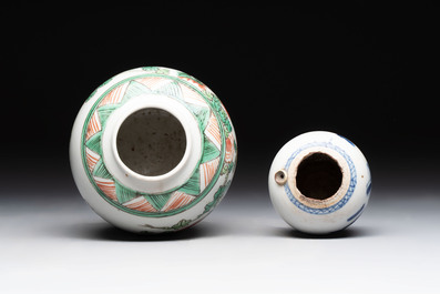 A Chinese famille verte covered vase, a pair of blue and white jars on wooden stands and two jars, 19th C.