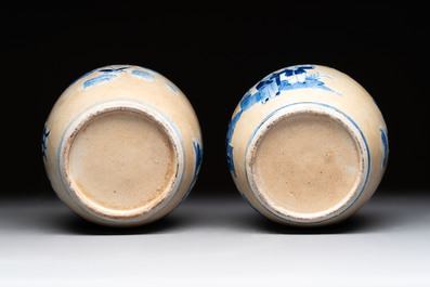 A Chinese famille verte covered vase, a pair of blue and white jars on wooden stands and two jars, 19th C.