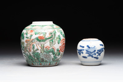A Chinese famille verte covered vase, a pair of blue and white jars on wooden stands and two jars, 19th C.