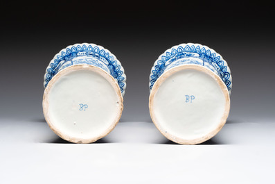 A blue and white Dutch Delft garniture of five vases and covers, 19th C.