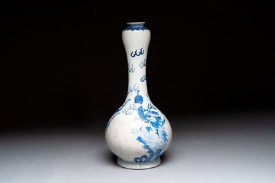 A Chinese blue, white and copper-red garlic-mouth vase with mythical animals, Kangxi mark, 19th C.