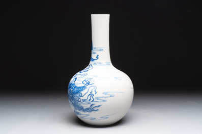 A Chinese blue and white bottle vase with narrative design, Qianlong mark, 19th C.