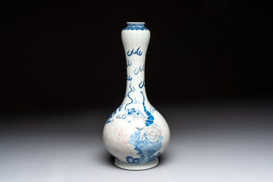 A Chinese blue, white and copper-red garlic-mouth vase with mythical animals, Kangxi mark, 19th C.