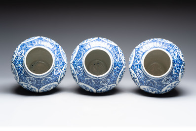 A blue and white Dutch Delft garniture of five vases and covers, 19th C.