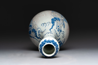 A Chinese blue, white and copper-red garlic-mouth vase with mythical animals, Kangxi mark, 19th C.