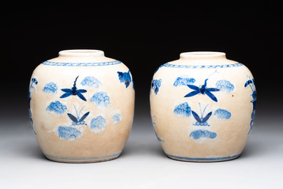 A Chinese famille verte covered vase, a pair of blue and white jars on wooden stands and two jars, 19th C.