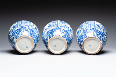 A blue and white Dutch Delft garniture of five vases and covers, 19th C.