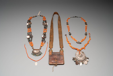 A varied group of four Islamic necklaces and a Koran holder, 19th C.
