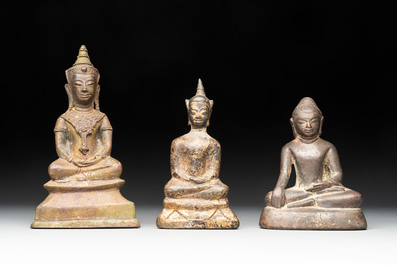 A varied collection of eight bronze Buddha figures, South Asia, 18/19th C.