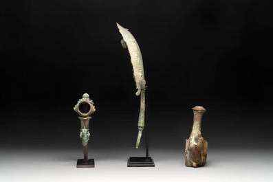 A collection of a bronze sculpture, three palanquin hooks and an elephant-form kendi, Cambodia, 13th C. and earlier