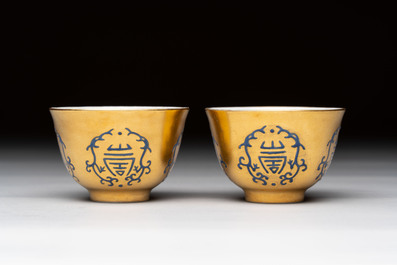 A pair of Chinese gilt-and blue-enamelled 'shou 壽' cups, Daoguang mark and possibly of the period