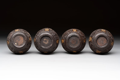 Four Chinese carved and silver-lined coconut cups, 19/20th C.