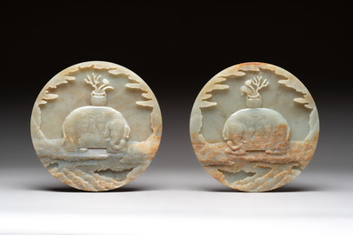 A pair of Chinese carved jade &lsquo;elephant&rsquo; plaques on wooden stands, 19th C.