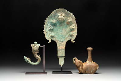 A collection of a bronze sculpture, three palanquin hooks and an elephant-form kendi, Cambodia, 13th C. and earlier