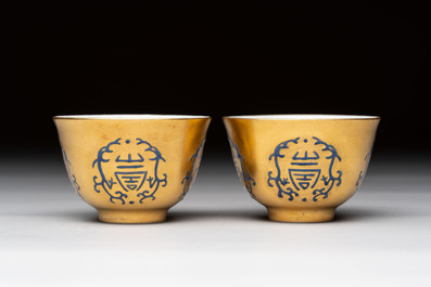 A pair of Chinese gilt-and blue-enamelled 'shou 壽' cups, Daoguang mark and possibly of the period
