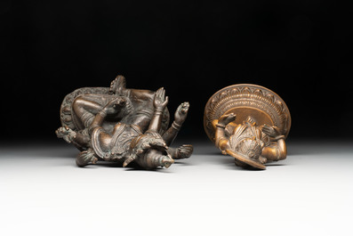 Seven bronze figures of deities and a religious relief plaque, India and Nepal, 18/19th C.