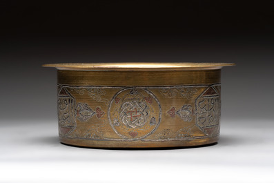 Three 'calligraphic' brass vessels, Qajar, 19/20th C.