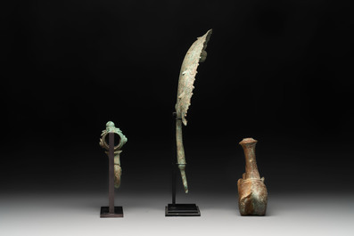 A collection of a bronze sculpture, three palanquin hooks and an elephant-form kendi, Cambodia, 13th C. and earlier