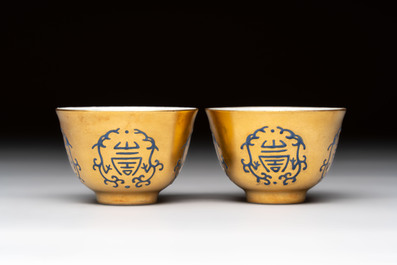A pair of Chinese gilt-and blue-enamelled 'shou 壽' cups, Daoguang mark and possibly of the period