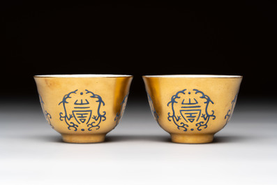 A pair of Chinese gilt-and blue-enamelled 'shou 壽' cups, Daoguang mark and possibly of the period